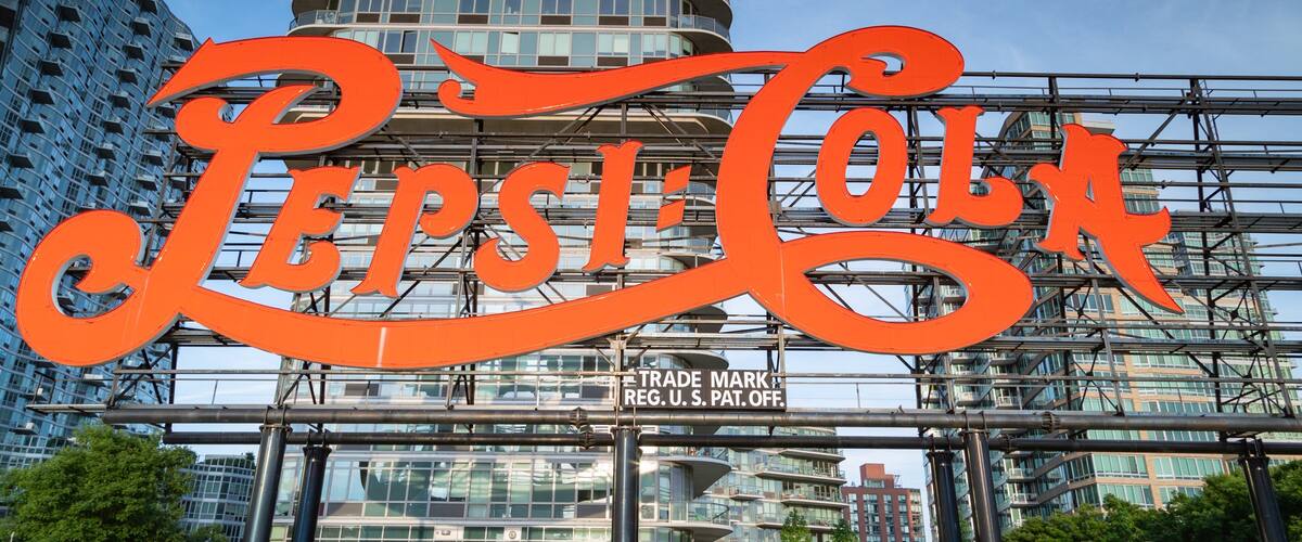 Gantry Plaza State Park featuring signage and a city