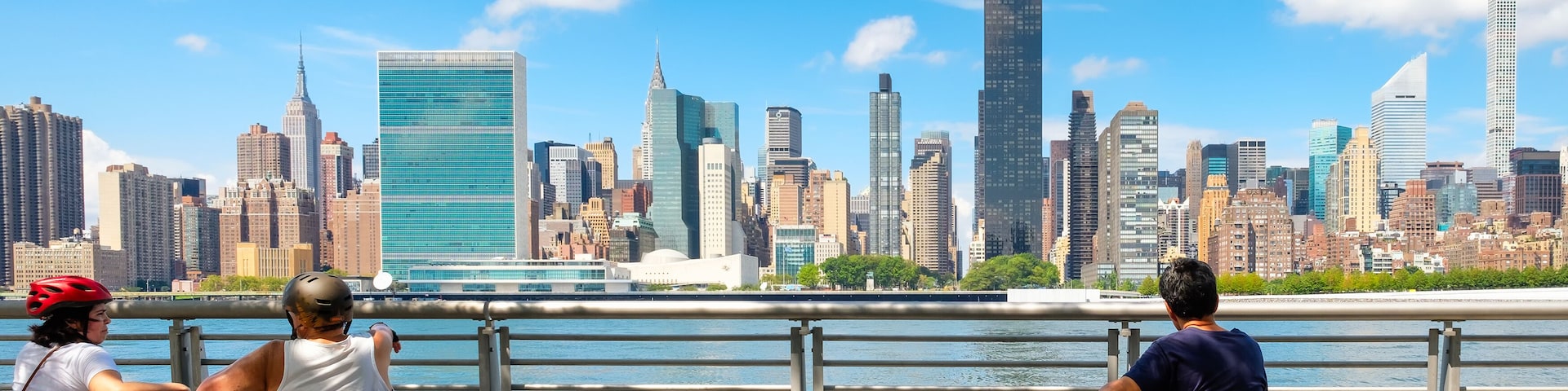 NewYorkers at a park in Queens with a view of the midtown Manhattan skyline