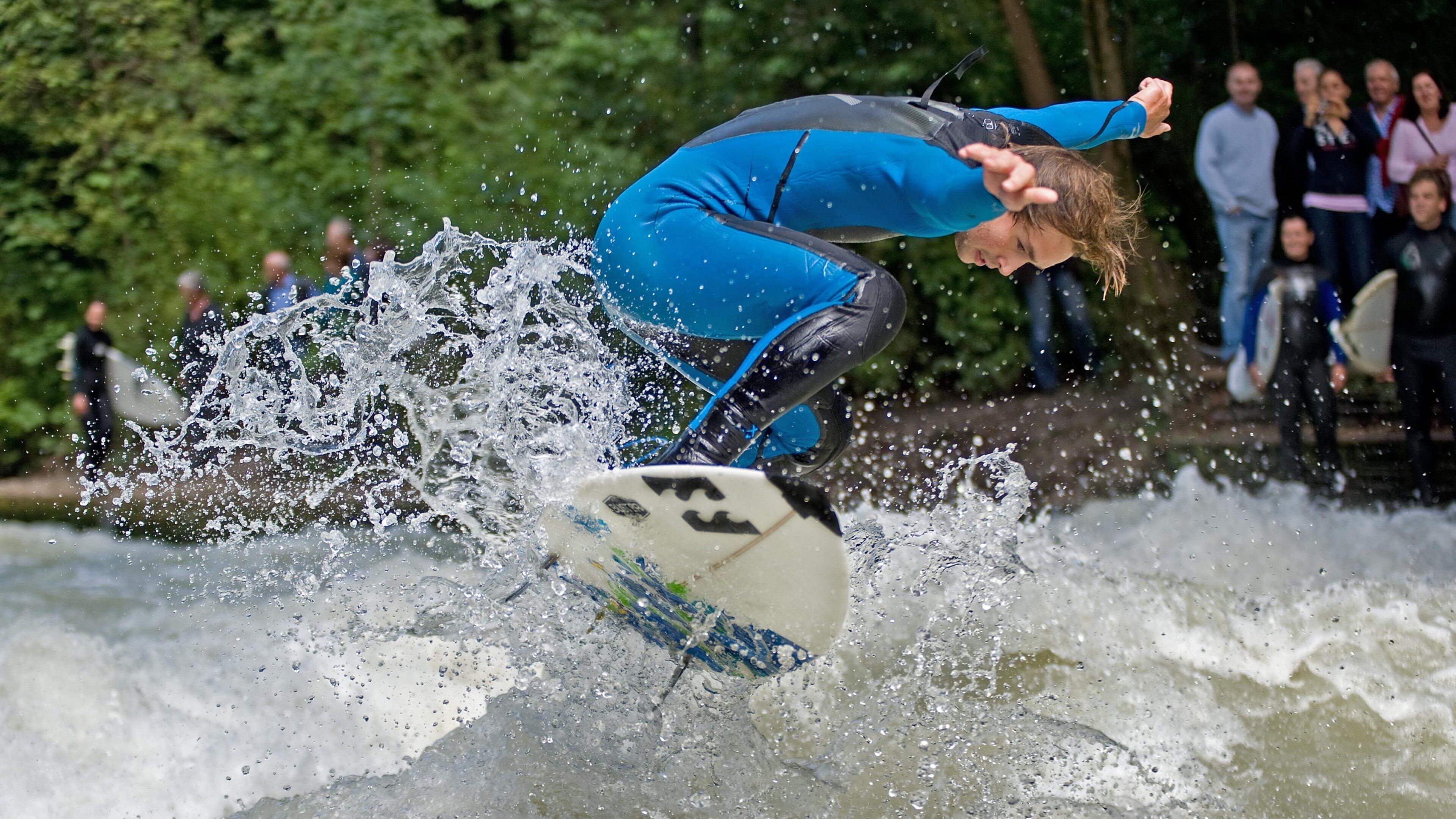 Eisbach Surfing which includes waves and surfing as well as an individual male