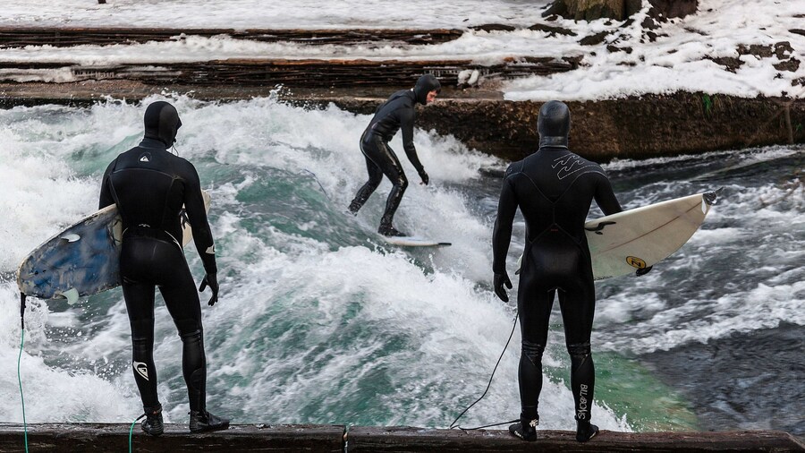 Eisbach Surfing which includes surfing and surf as well as a small group of people