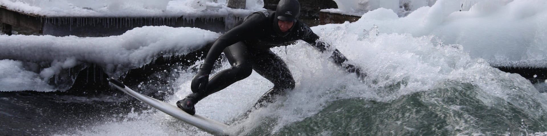 Eisbach Surfing featuring surf and surfing as well as an individual male