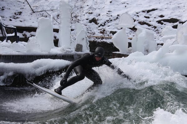 Eisbach Surfing featuring surf and surfing as well as an individual male