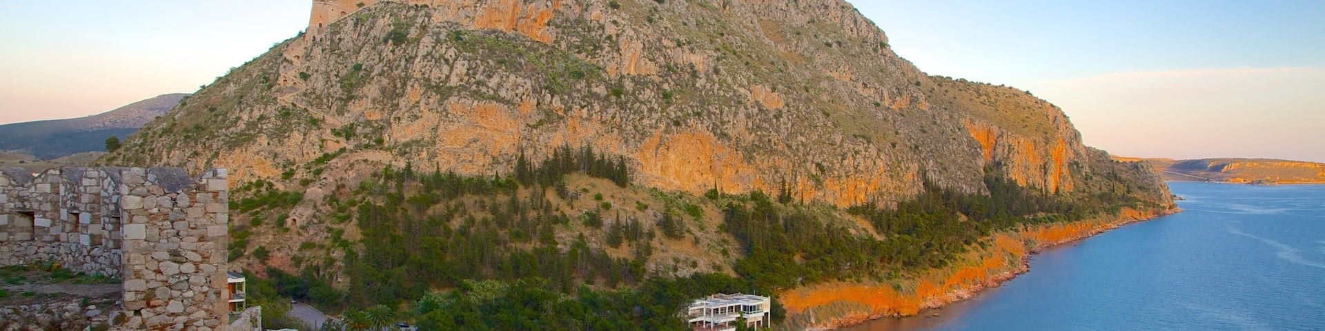 Arvanitia Beach showing general coastal views and a sunset