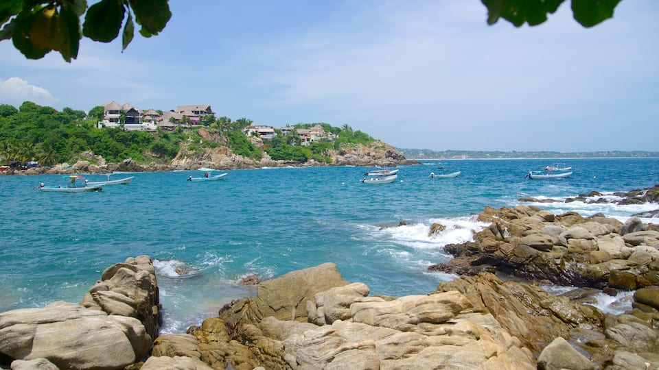 Puerto Angelito Beach showing rocky coastline and a bay or harbor