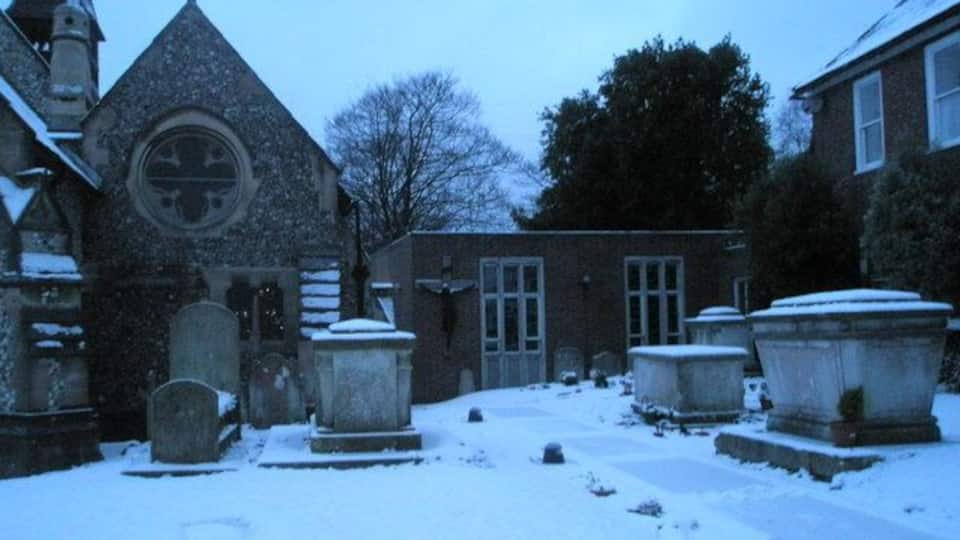 Tombs by the church hall of SS Peter and Paul, Wymering, Hampshire