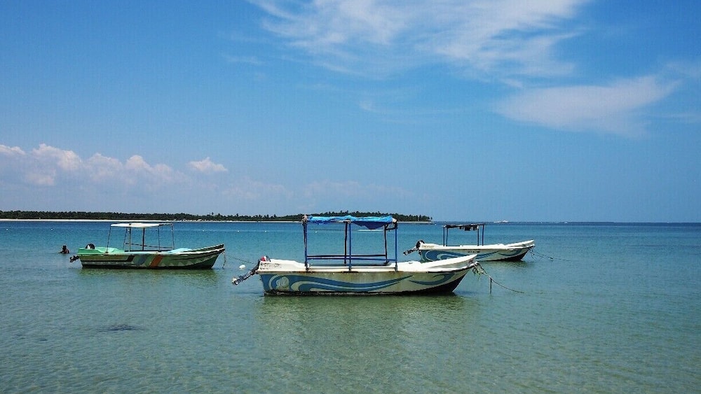 This is one among the famous beaches in Sri Lanka. Water is crystal clear through-out the year except in monsoon months. There are several star hotels along the coast where you can spend your holidays fruitfully. According to me, "Malu Malu" is the best accommodation though it is quite expensive.
Sun bathing or hiding yourself under a Palmyra tree are very exiting ways of relaxing in this amazing beach. And also you can take a guided boat tour according to your interest. Probably, you can see lots of corals and variety of colourful fish while riding the boat. If you are lucky enough, you will be able to snap a sea turtle too.
