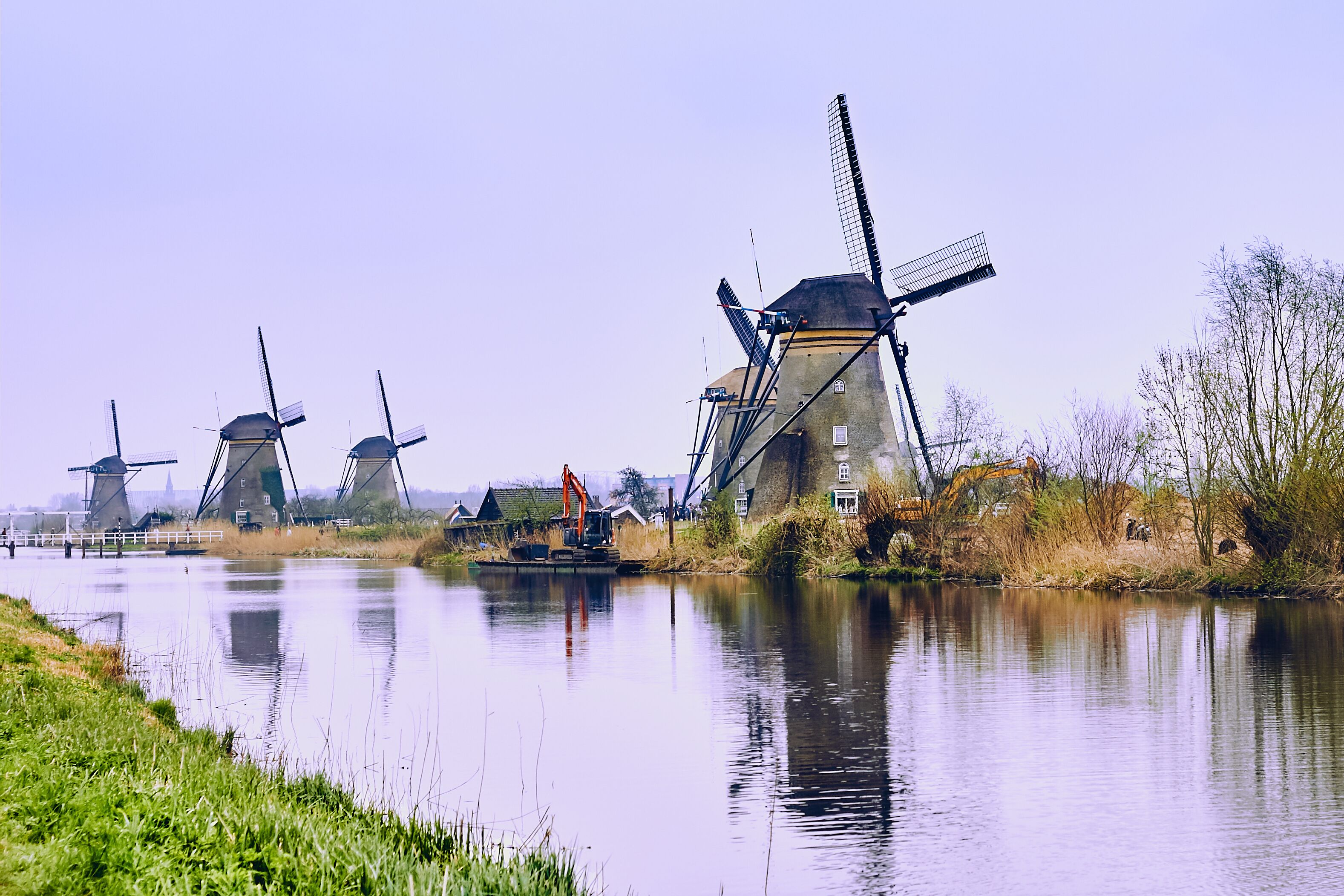 View of traditional 18th century windmills and water canal in Kinderdijk, Holland, Netherlands