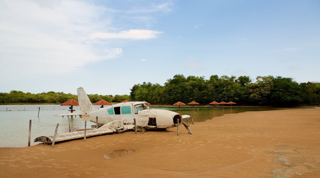 Figueira Beach showing a beach, aircraft and general coastal views