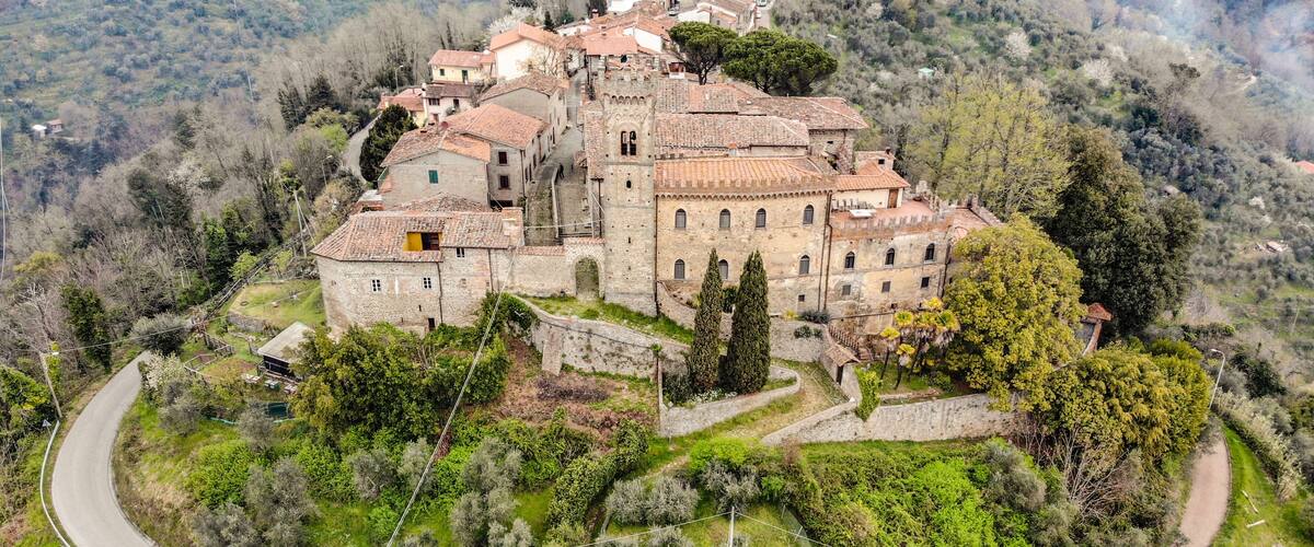 A historic village with stone buildings and a winding road.