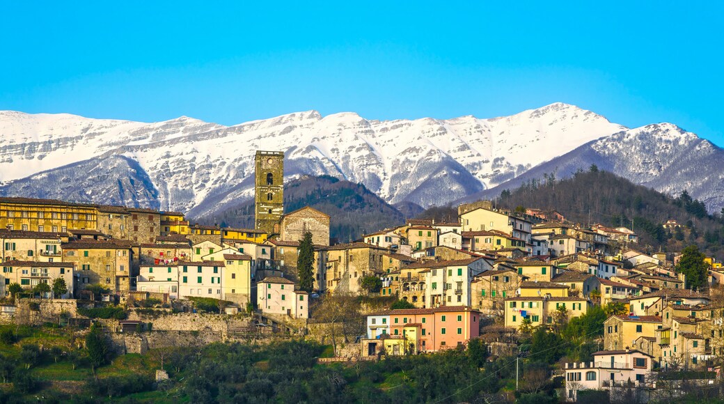 Coreglia Antelminelli village and snowy mountains on background. Garfagnana, Tuscany, Italy.