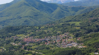 A mountainous landscape with a small town nestled in the valley.