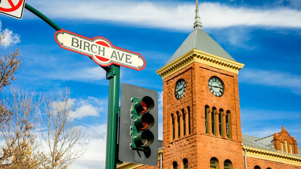 Cityscape view of Birch Avenue street sign with clock tower in Flagstaff, Arizona.; Shutterstock ID 529212391