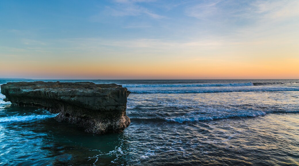 Sunset beach in Bali - Echo beach. Rocks, waves and magic sea landscape view with a beautiful evening sky. Indonesia, Indian Ocean; Shutterstock ID 637110094; Purchase Order: -