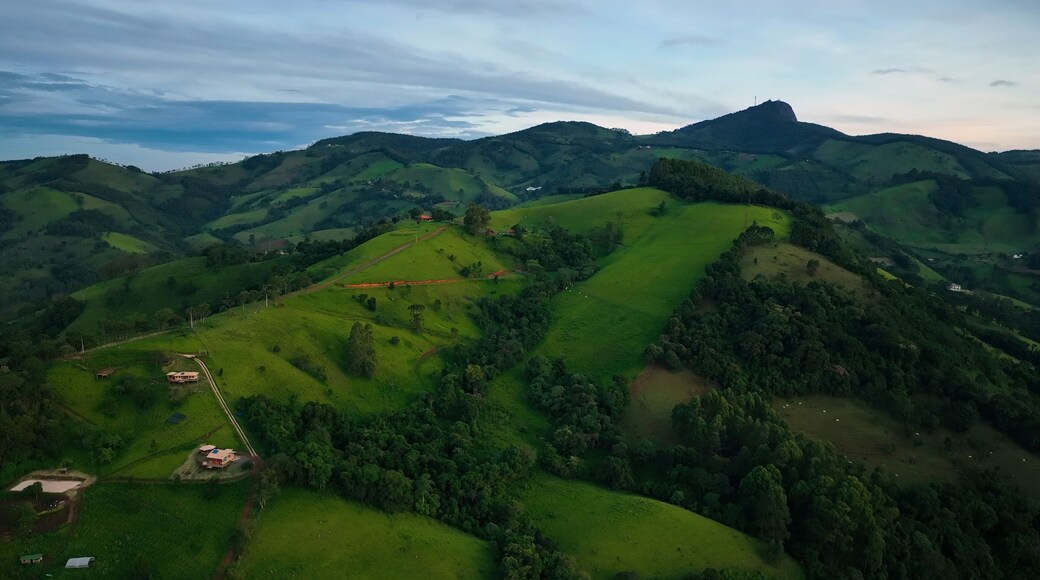 Aerial view of lush green hills and serene mountains in a picturesque valley, Monte Verde, Minas Gerais, Brazil.