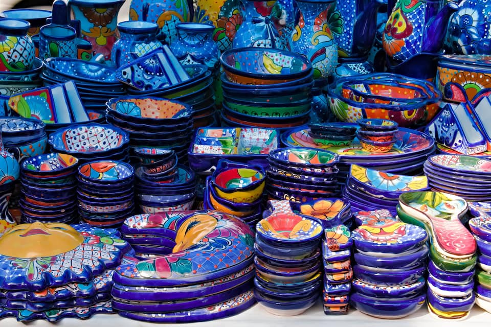 A variety of colorful ceramic bowls and plates.