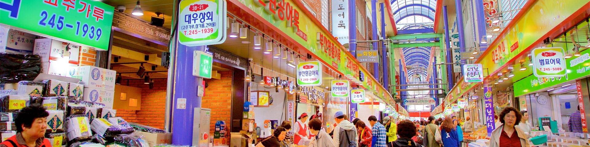 Gukje Market featuring markets and interior views as well as a small group of people