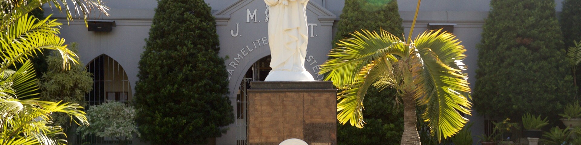 Carmelite Monastery showing a statue or sculpture and a park