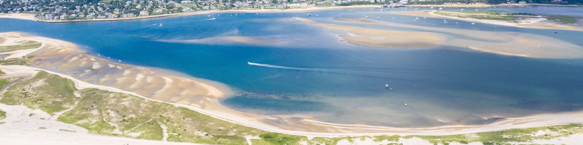 The nutrient-rich waters of the Atlantic Ocean bathe a scenic beach on Cape Cod, Massachusetts. This beautiful area of New England, not too far from Boston, is a popular summer vacation destination.