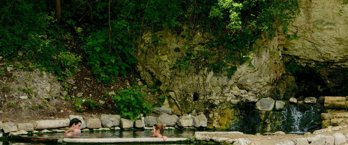 Bagni San Filippo showing a lake or waterhole as well as a couple