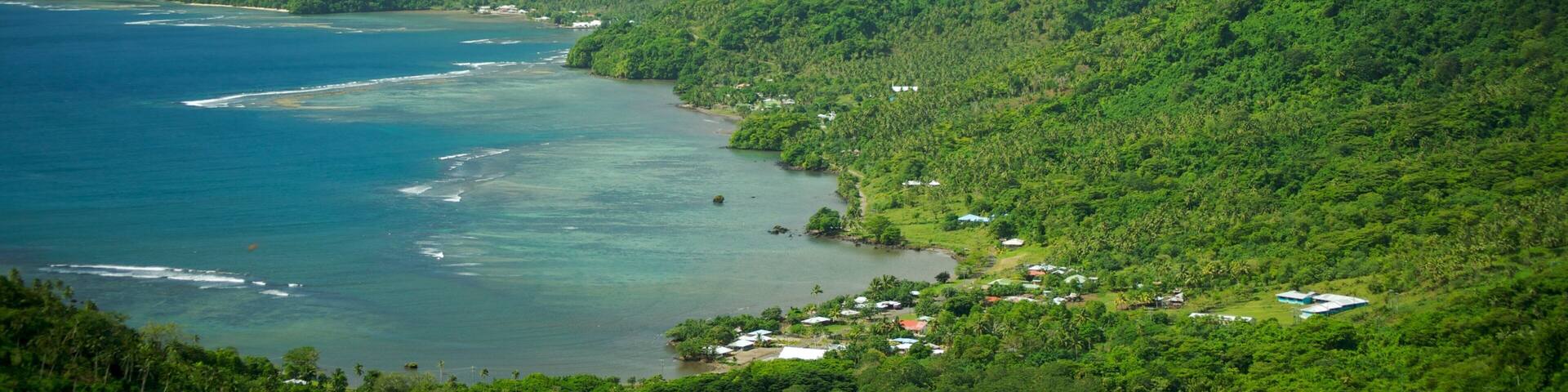 Upolu featuring mountains, a bay or harbor and a coastal town