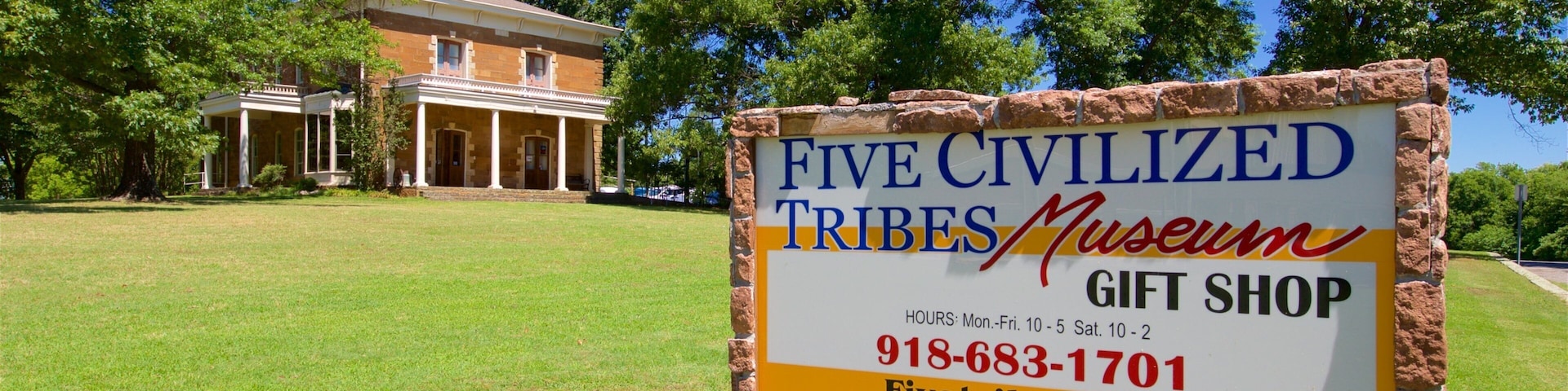 Five Civilized Tribes Museum featuring heritage elements, signage and a house