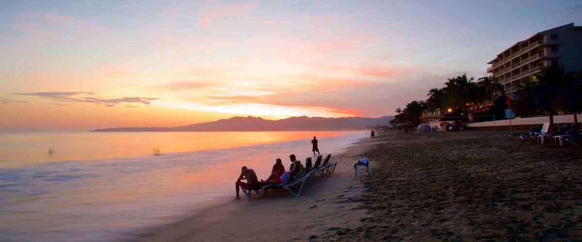 Nuevo Vallarta Beach which includes a sandy beach, a sunset and general coastal views