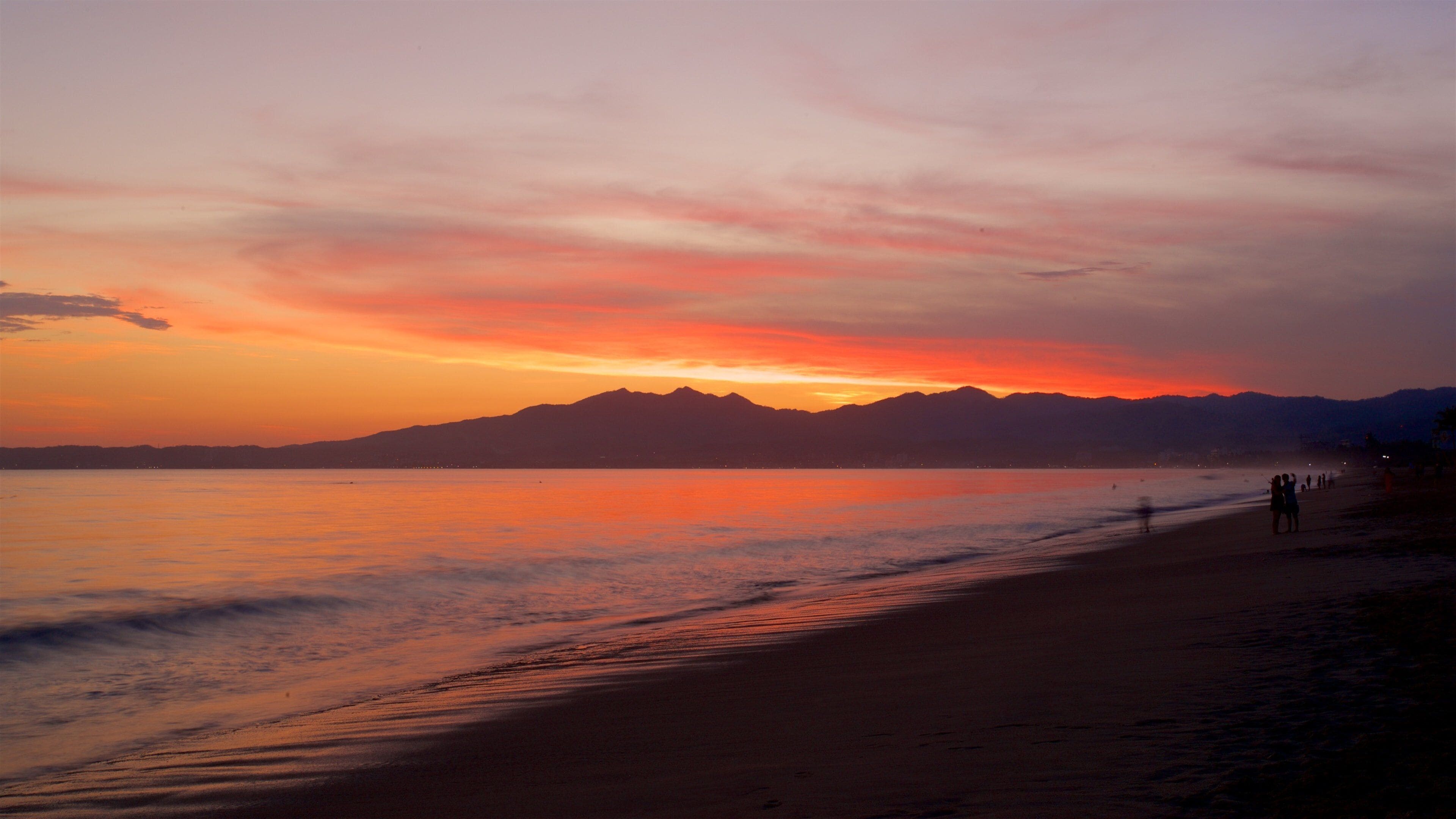 Nuevo Vallarta Beach showing general coastal views, a sandy beach and a sunset