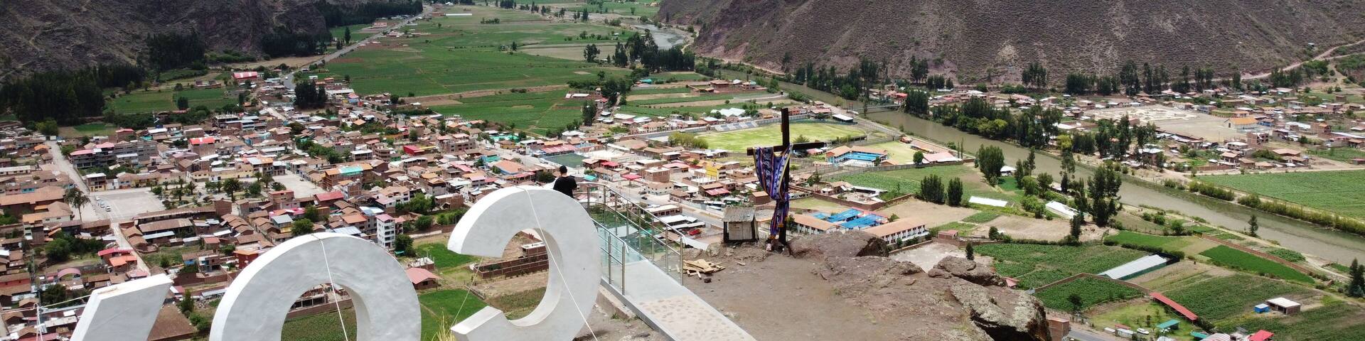 Drone lookout coya glass bridge Aerial view of Village of Coya and the Urubamba river, Sacred Valley, Cusco, Peru