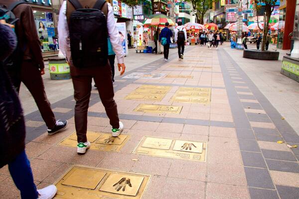 BIFF Square showing a city as well as a small group of people