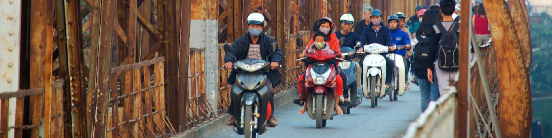 Long Bien Bridge which includes a bridge as well as a large group of people