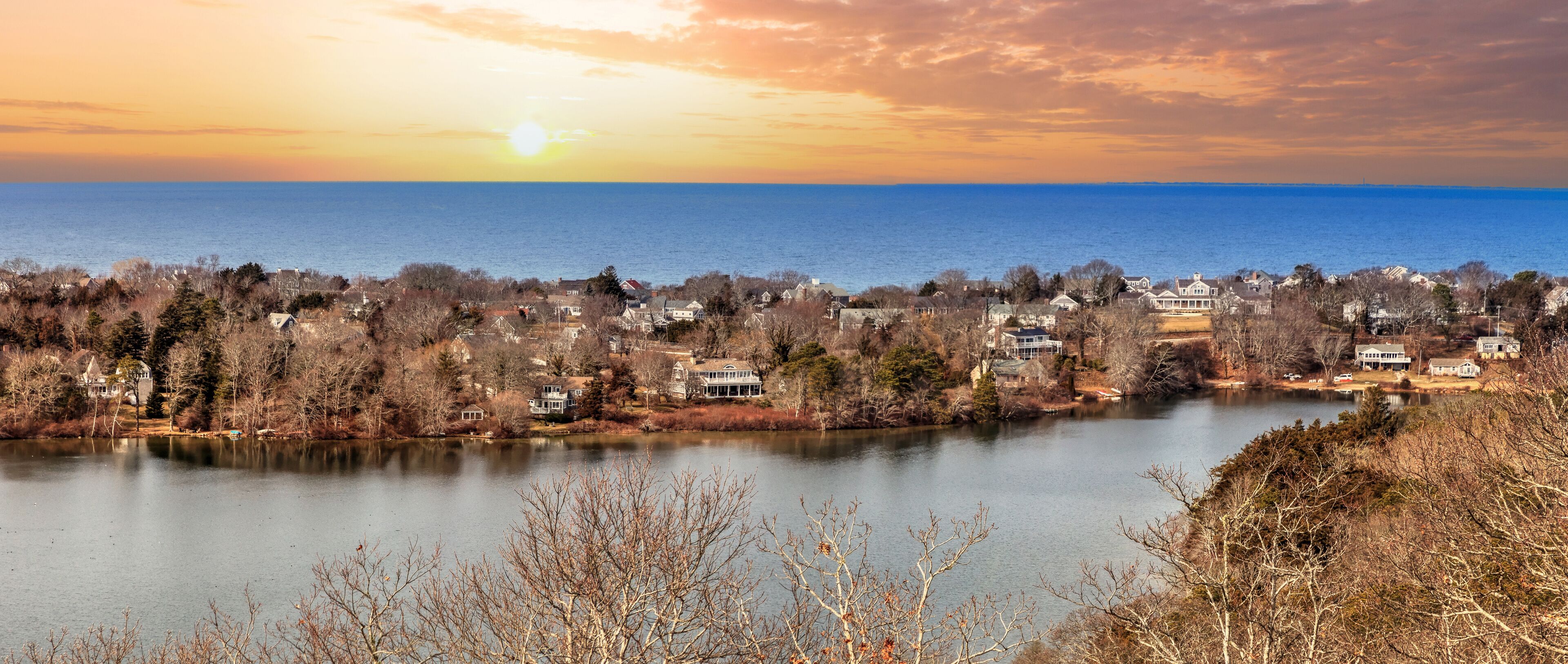 Skyline view of sunrise over Scargo lake and the ocean from the Scargo Tower in Dennis