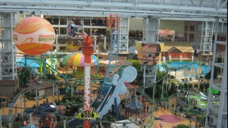 A Nickelodeon Universe indoor theme park with various rides and attractions.