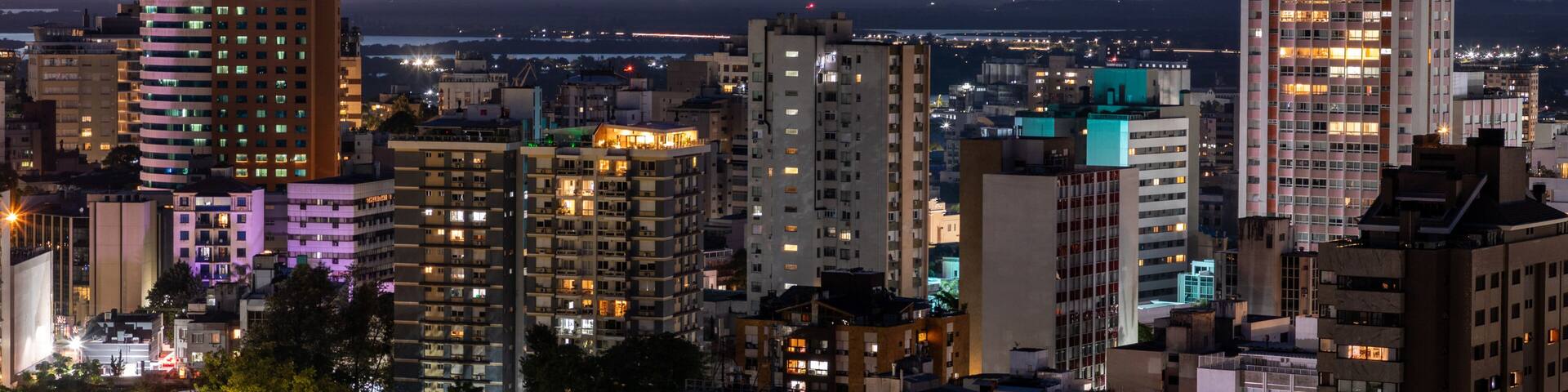 Moinhos de Vento neighborhood at sunset and first night lights and airplane lights