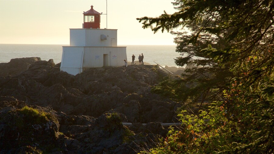 Amphitrite Point Lighthouse featuring a lighthouse, general coastal views and a sunset