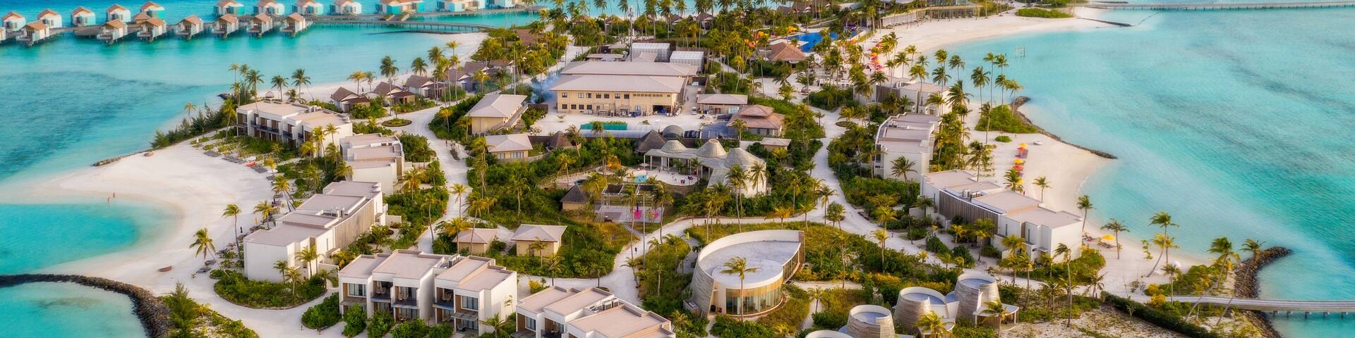 Amazing bird eyes view in Maldives island Eh'mafushi crossroads maldives at sunrise. Aerial drone shot. Hard rock hotel. July 2021