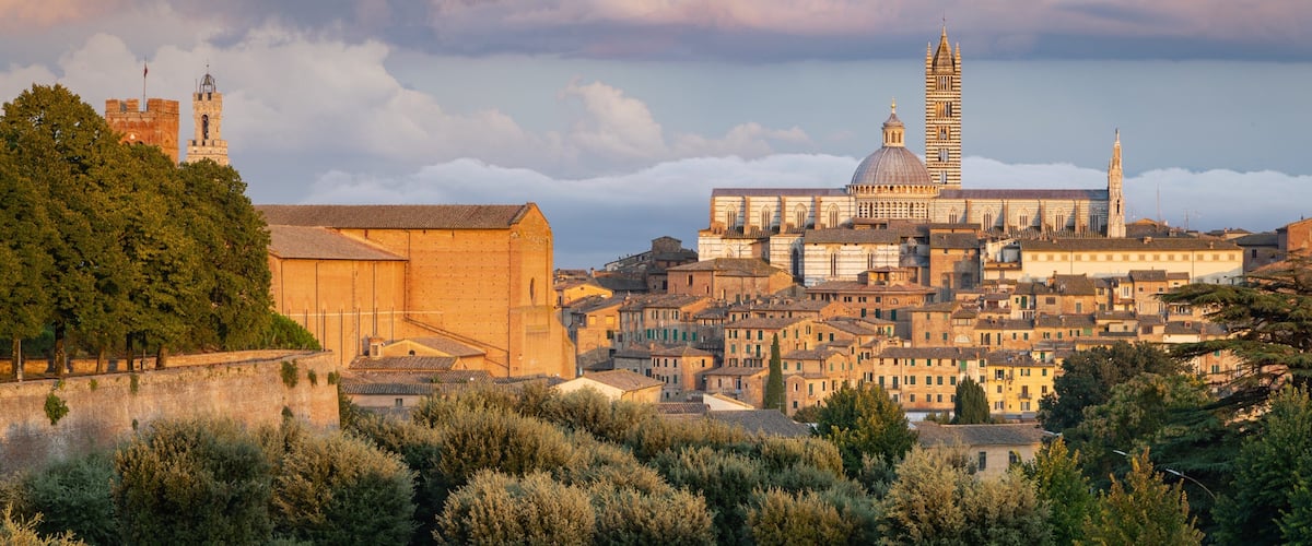 Fortezza Medicea featuring a sunset, a city and landscape views