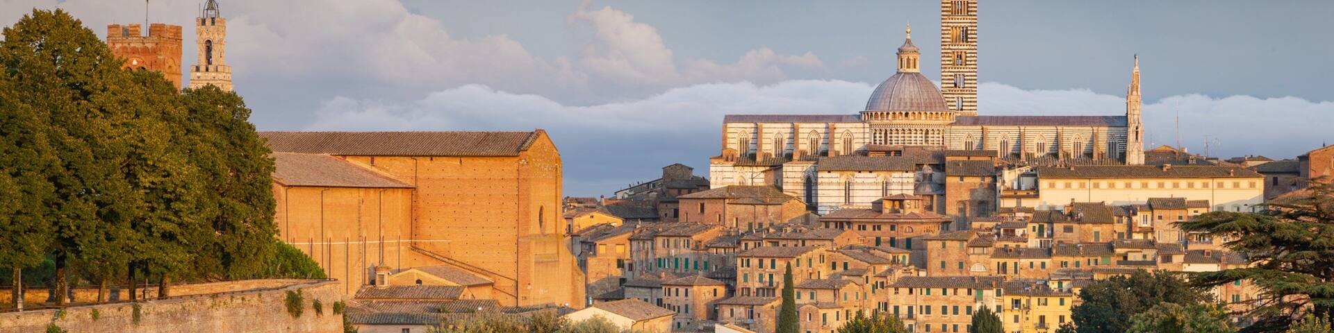 Fortezza Medicea featuring a sunset, a city and landscape views