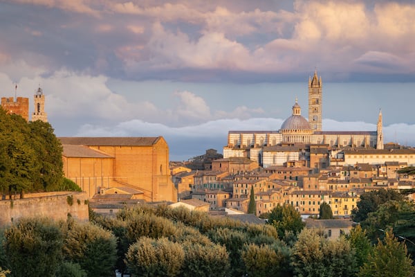 Fortezza Medicea featuring a sunset, a city and landscape views