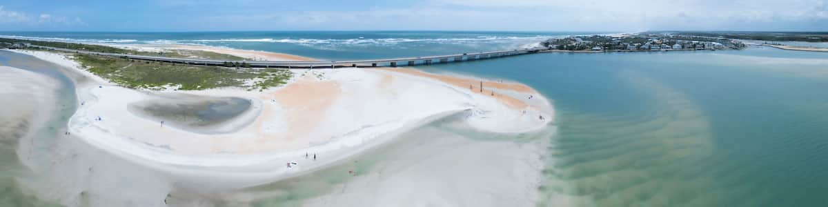 Aerial view of abstract panorama of crescent beach at low tide, St. Augustine, United States.