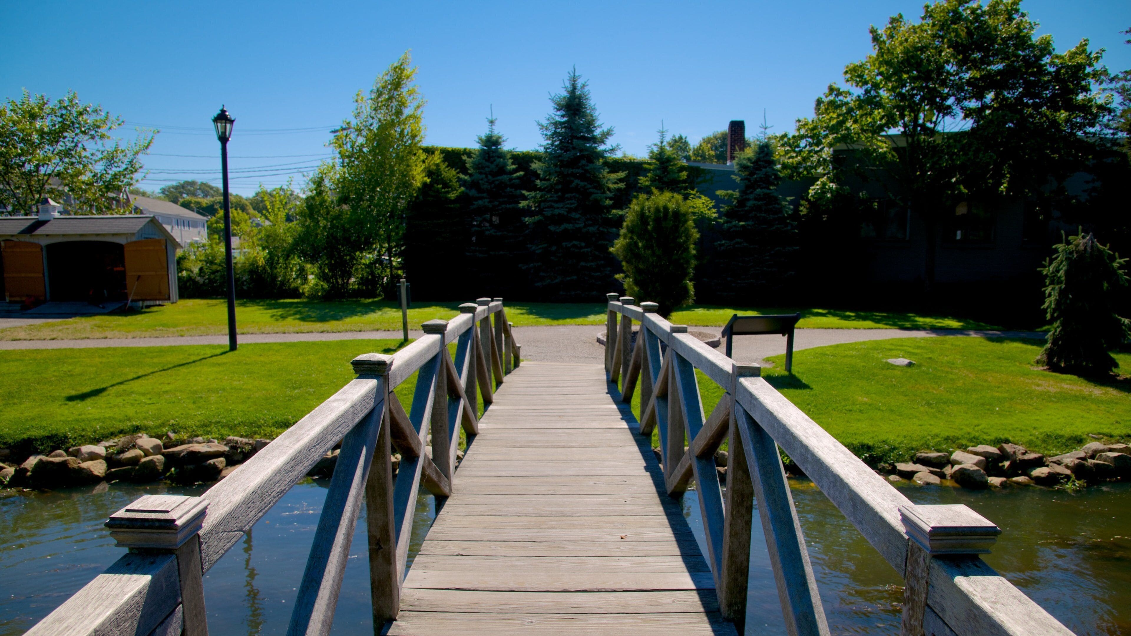 Brewster Gardens showing a river or creek, a park and a bridge