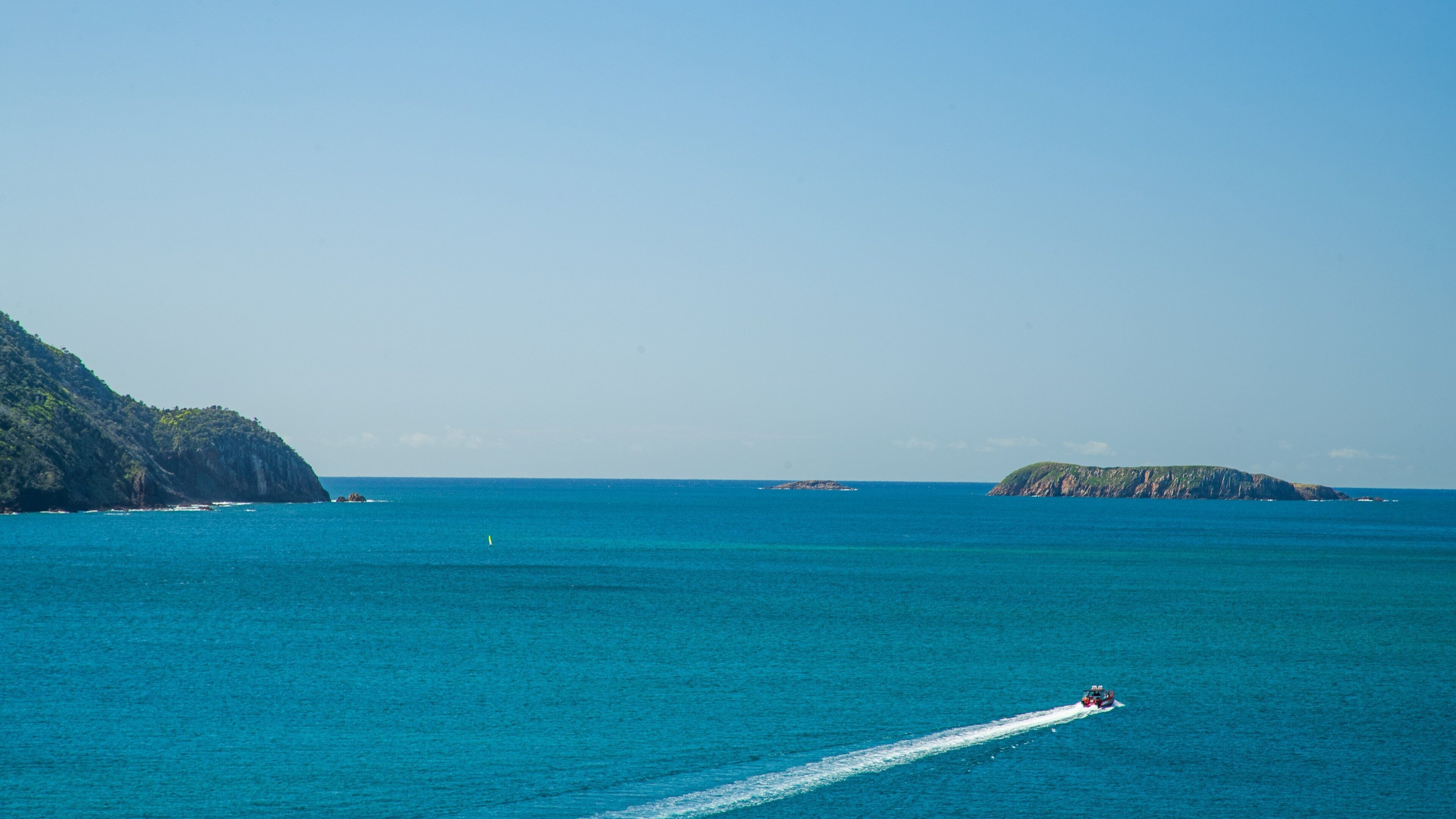 Nelson Head Lighthouse featuring general coastal views, boating and landscape views