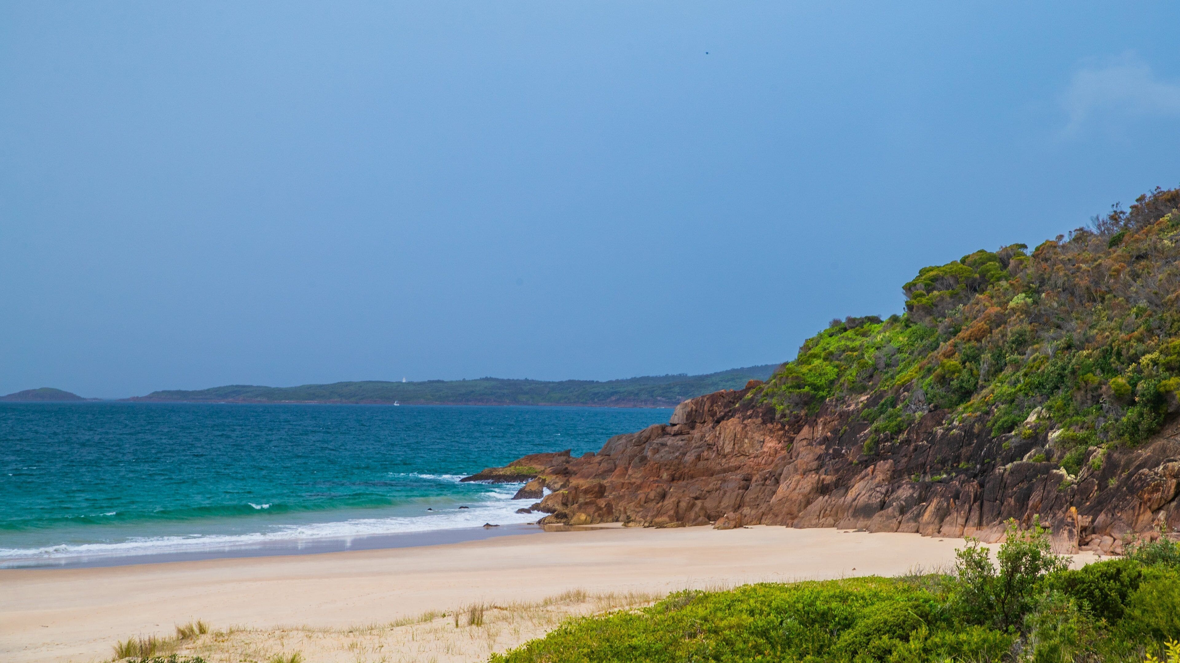 Tomaree National Park which includes rugged coastline, a beach and general coastal views
