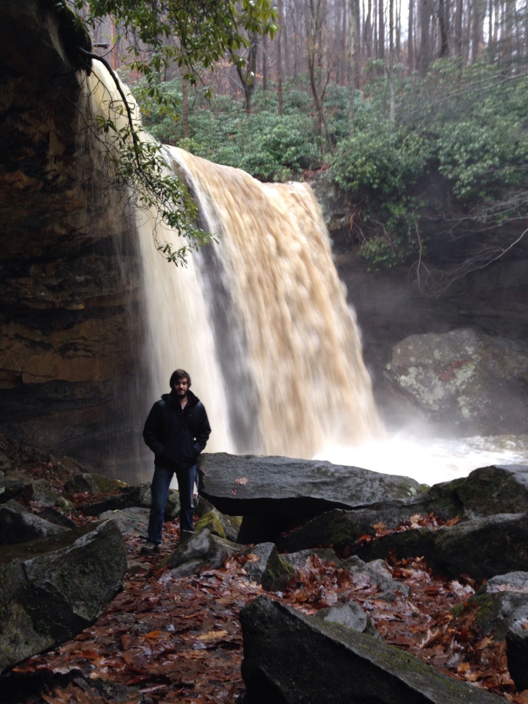 My fiancé at cucumber falls after a nice rain storm