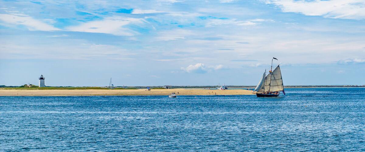wo-masted yacht and Beautiful landscape of ocean beach Cape cod Massachusetts