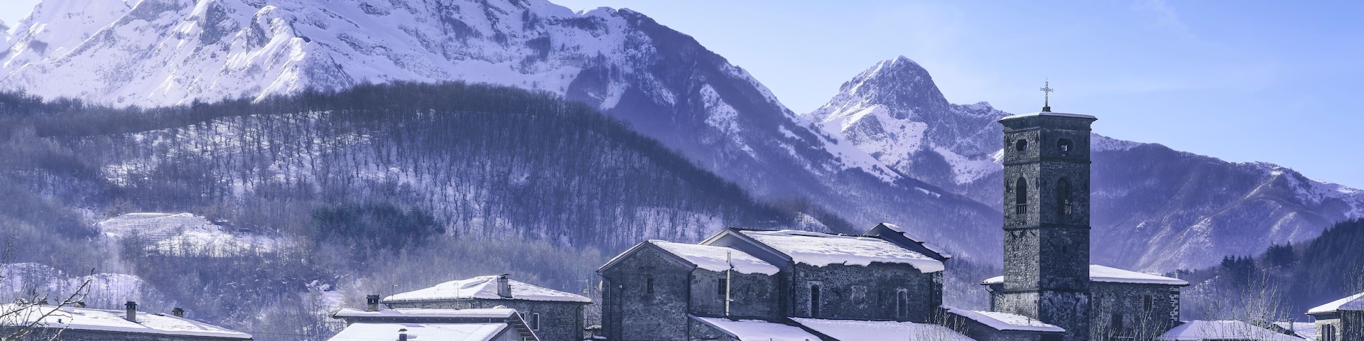 Piazza al Serchio snowy village and Apuan mountains in winter. Garfagnana, Tuscany, Italy