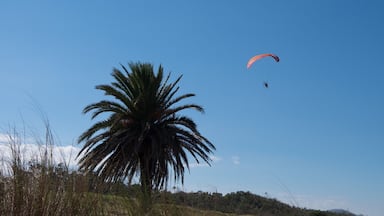 Parasailing over Las Flores Beach, on a very hot day during the summer at Maldonado, Uruguay.