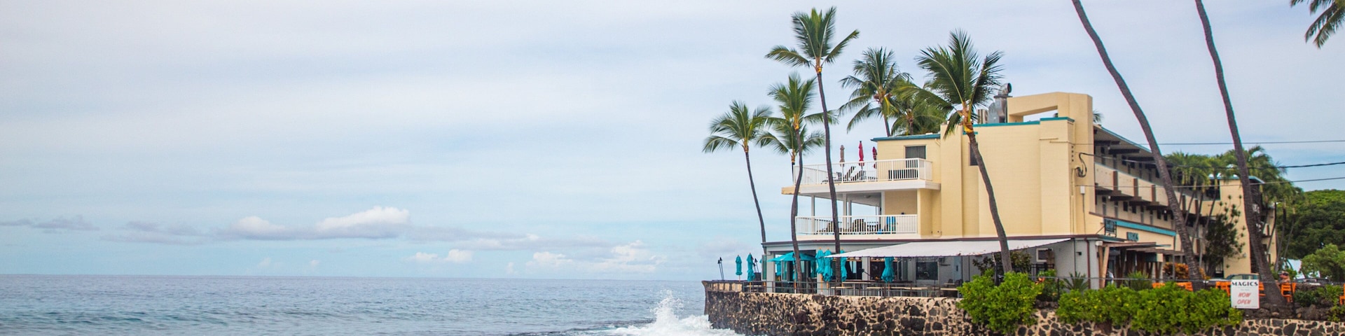 Magic Sands Beach which includes a sandy beach, a coastal town and general coastal views