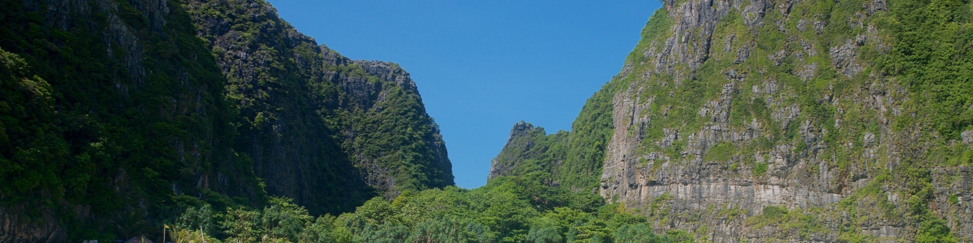 Maya Bay which includes a gorge or canyon, boating and tropical scenes