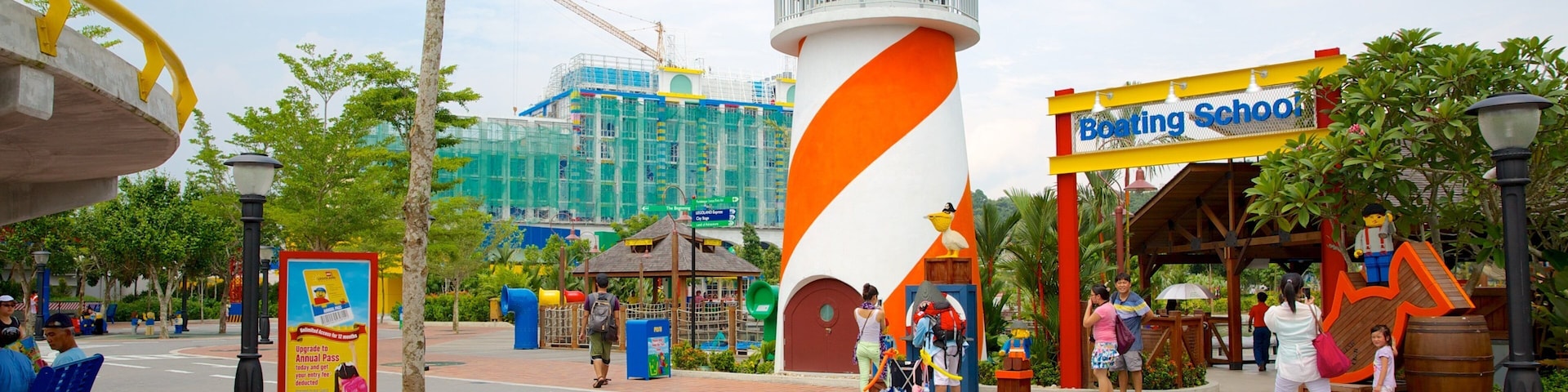 Johor Bahru featuring rides, signage and street scenes