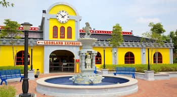 Johor Bahru showing a fountain, signage and rides